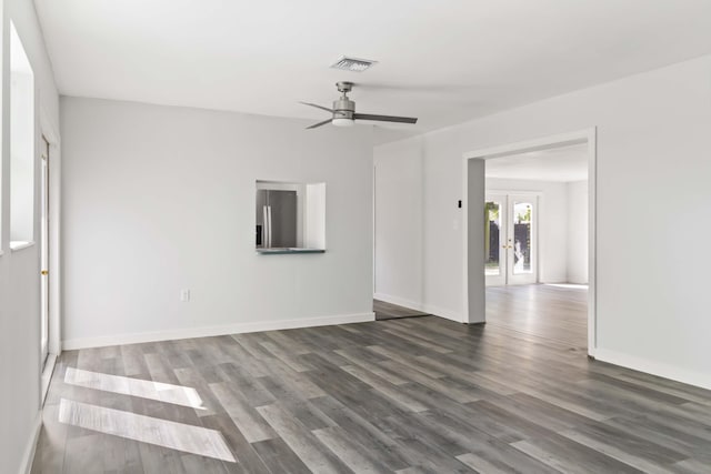 unfurnished room with french doors, ceiling fan, and dark hardwood / wood-style floors