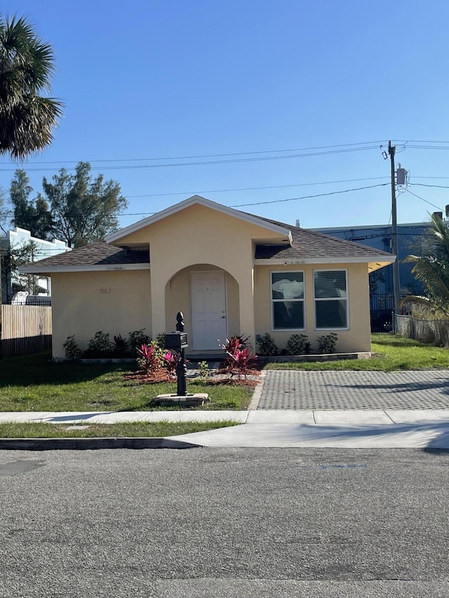 single story home with a front yard