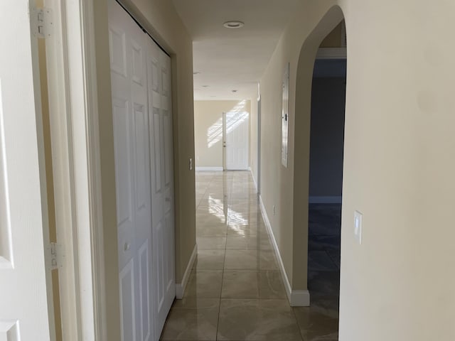 hallway with light tile patterned flooring