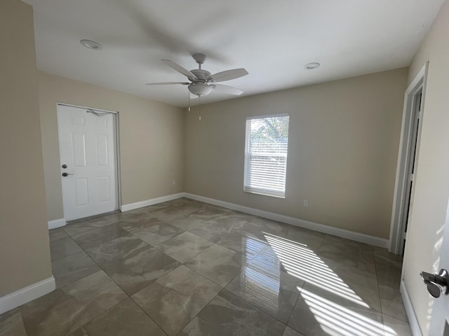 spare room featuring ceiling fan