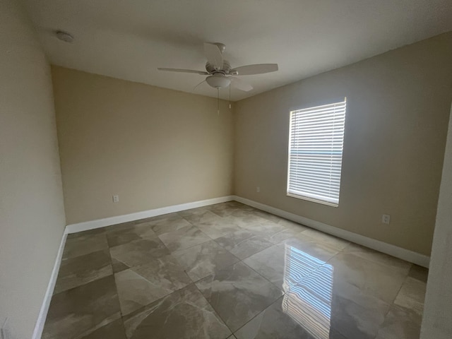 spare room featuring ceiling fan