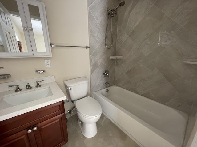 full bathroom featuring vanity, tiled shower / bath combo, tile patterned floors, and toilet