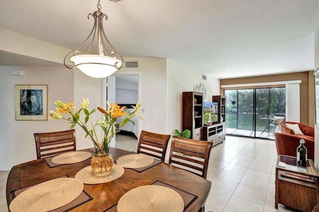 dining area featuring light tile patterned floors