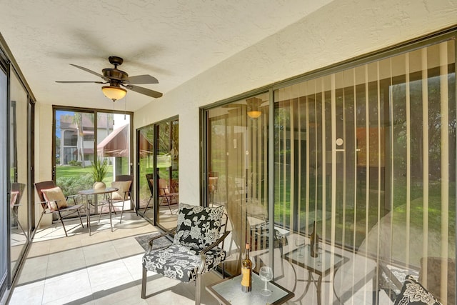 sunroom featuring ceiling fan