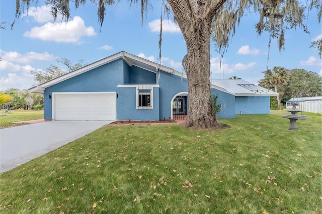 single story home featuring a front yard and a garage