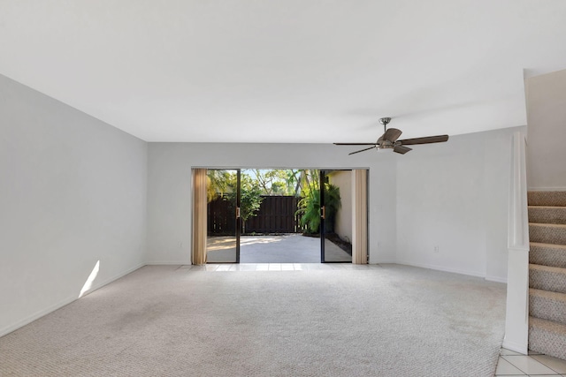 empty room with light colored carpet and ceiling fan