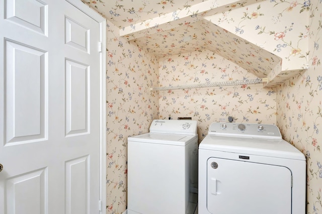 laundry room featuring washing machine and clothes dryer