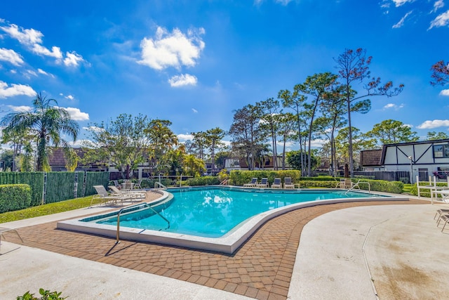 view of swimming pool featuring a patio