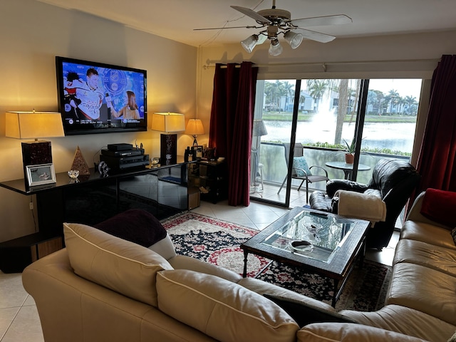 living area featuring light tile patterned floors and ceiling fan