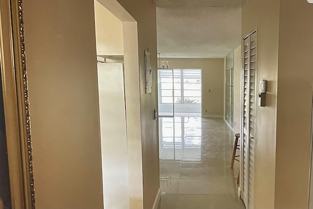 corridor featuring light tile patterned flooring