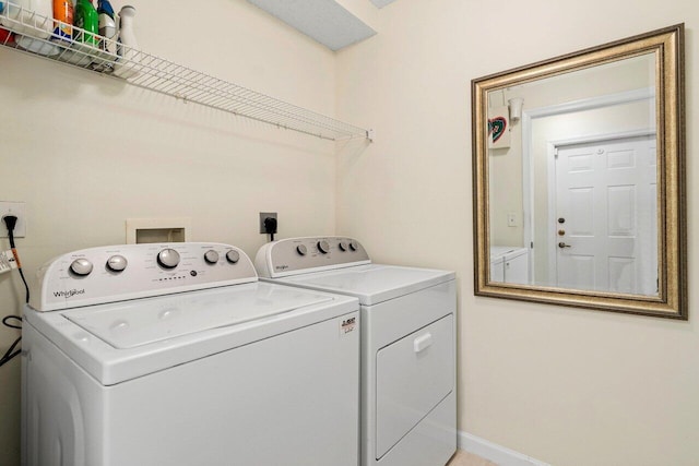 laundry area with separate washer and dryer