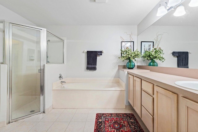 bathroom with vanity, tile patterned floors, and shower with separate bathtub