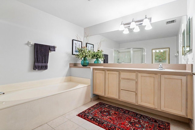 bathroom with shower with separate bathtub, tile patterned floors, and vanity