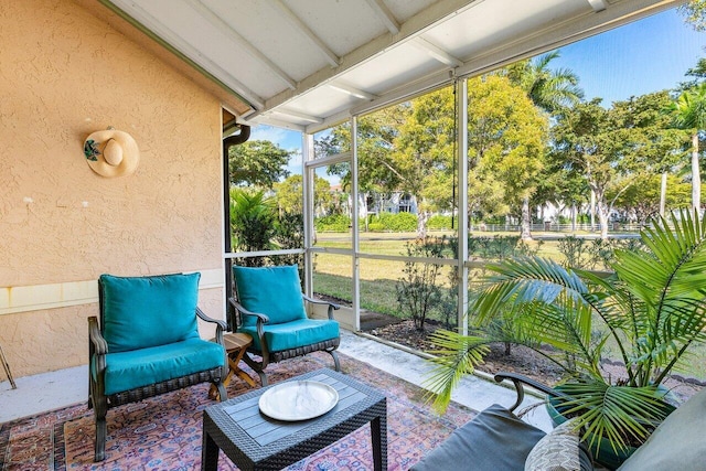 sunroom with beamed ceiling