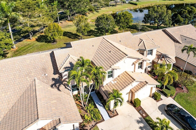 drone / aerial view with a water view