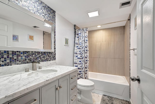 full bathroom featuring tasteful backsplash, vanity, toilet, and shower / bath combo with shower curtain