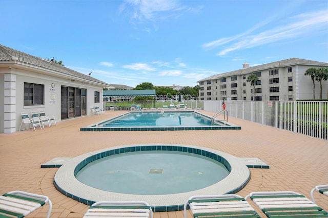 view of pool featuring a patio