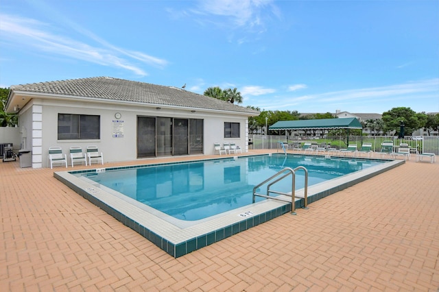 view of swimming pool with a patio area