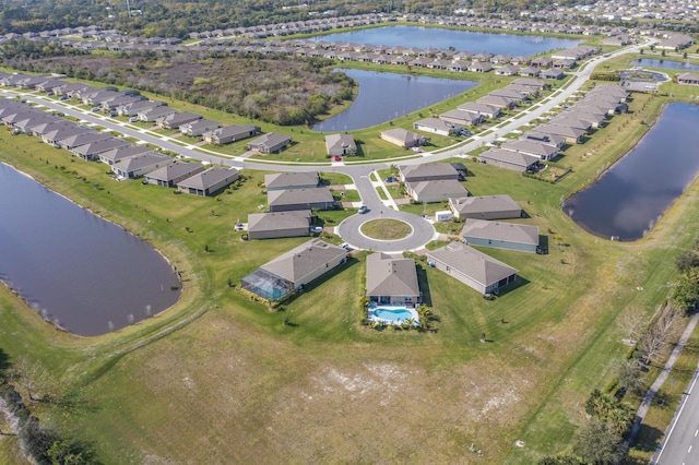 aerial view with a residential view and a water view