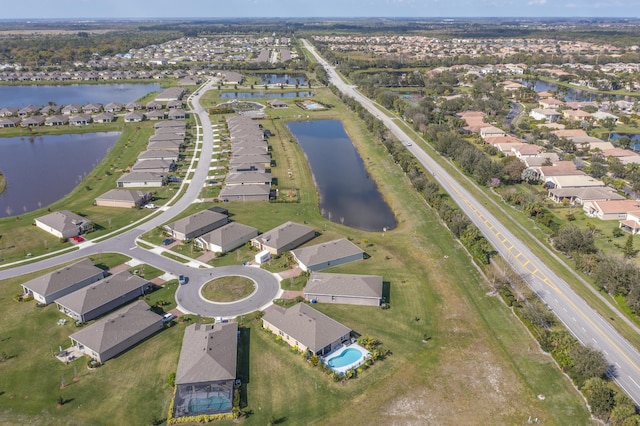 aerial view featuring a water view and a residential view