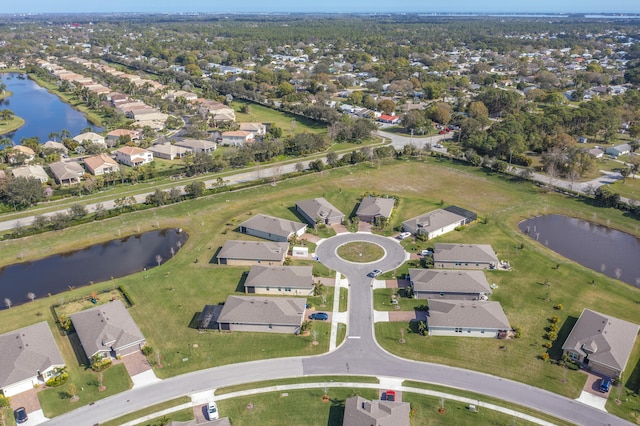 bird's eye view featuring a water view and a residential view