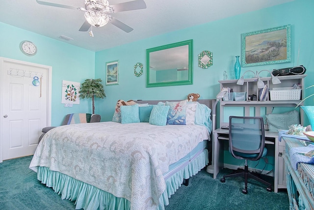 bedroom featuring dark colored carpet and ceiling fan