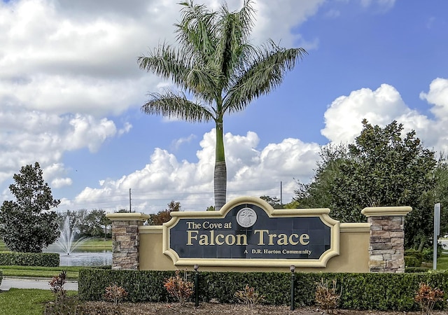 community / neighborhood sign featuring a water view