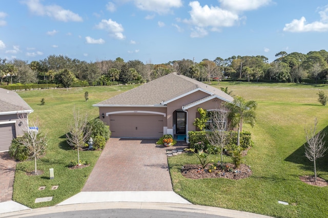 single story home with a garage and a front yard