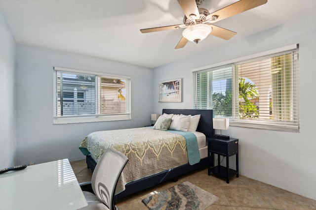 bedroom with tile patterned flooring and ceiling fan