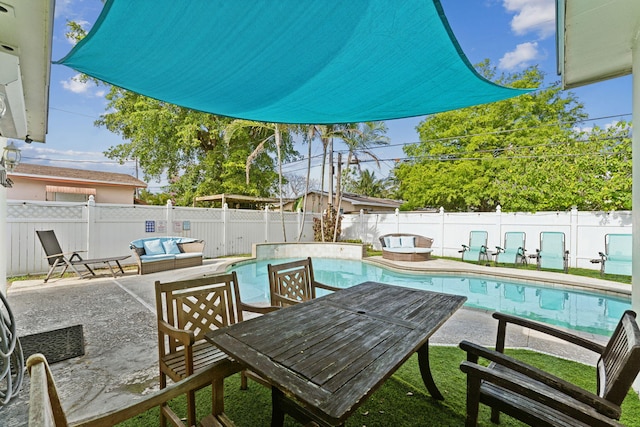 view of swimming pool with an outdoor living space and a patio