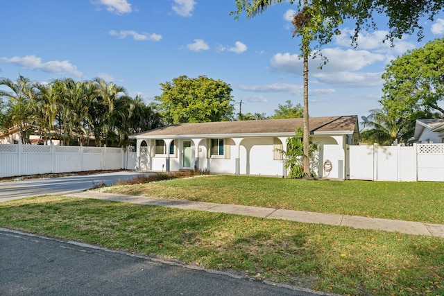 single story home with a front yard