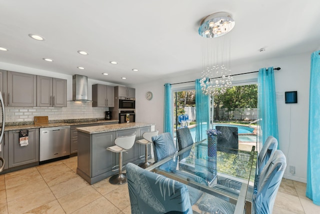 dining room featuring light tile patterned floors and a chandelier