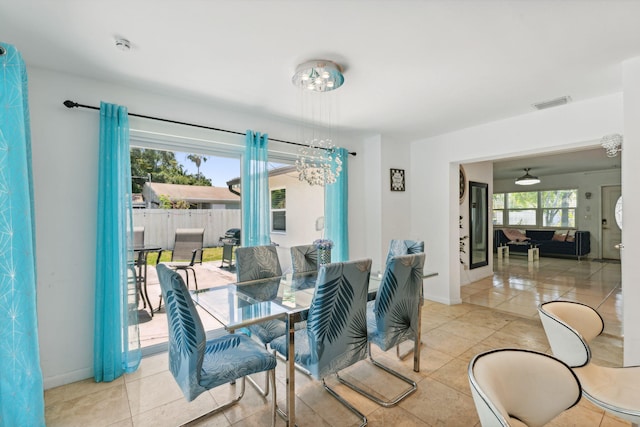 dining room featuring an inviting chandelier and light tile patterned floors