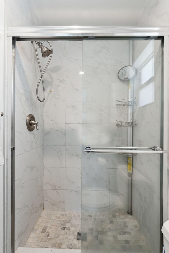 bathroom with an enclosed shower