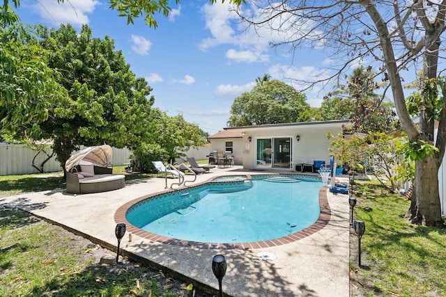 view of swimming pool with a patio