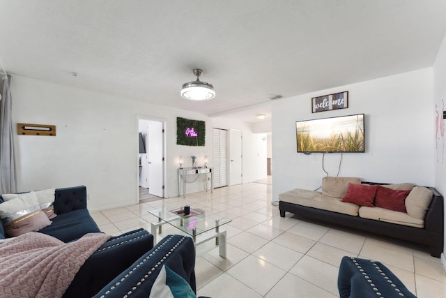 living room with light tile patterned flooring