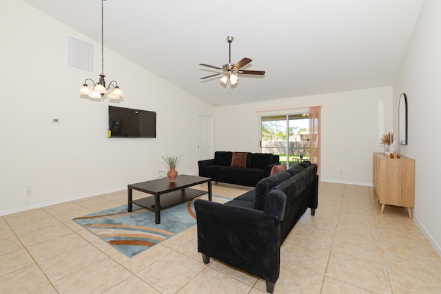 tiled living room with high vaulted ceiling and ceiling fan with notable chandelier