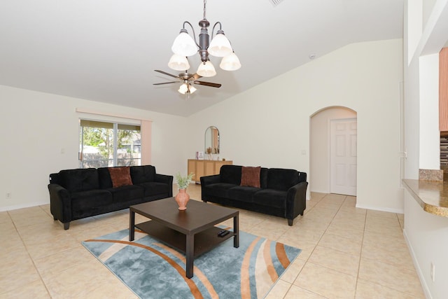 living room featuring ceiling fan, light tile patterned floors, and lofted ceiling