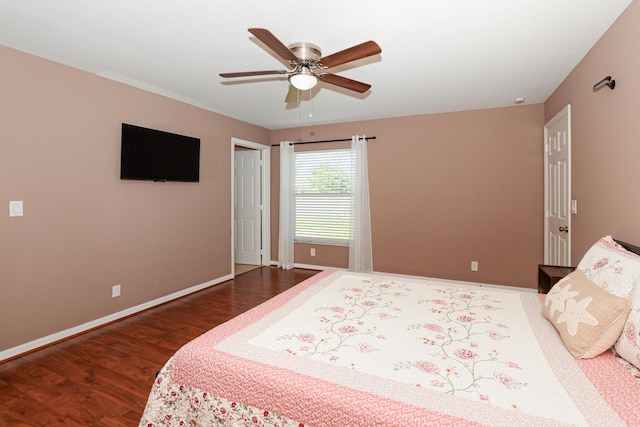 bedroom with dark hardwood / wood-style floors and ceiling fan