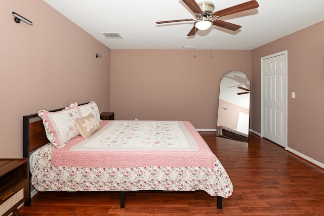 bedroom with dark wood-type flooring and ceiling fan