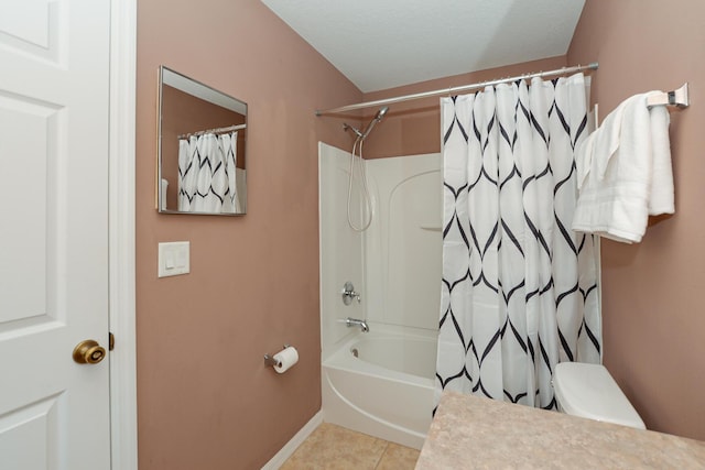 bathroom with shower / bath combo with shower curtain and tile patterned flooring