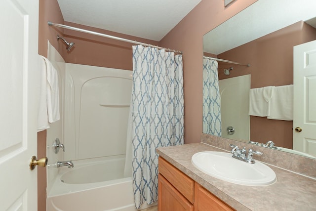 bathroom featuring shower / bathtub combination with curtain and vanity