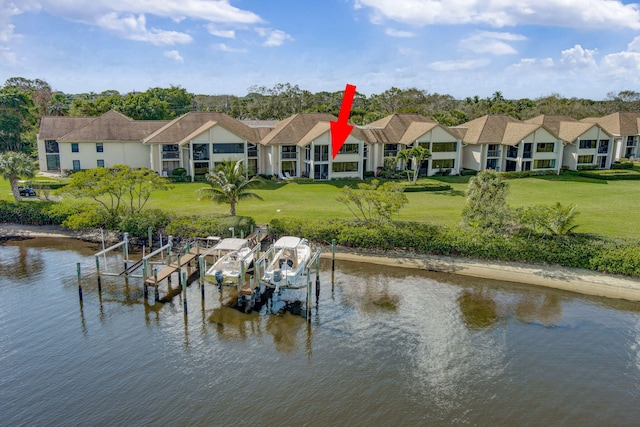 dock area featuring a water view and a yard