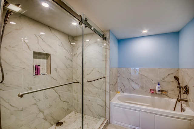 122 Lakeshore Dr Unit Ph34, North Palm Beach, FL 33408 - bathroom with a marble finish shower, a garden tub, and recessed lighting