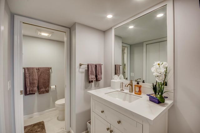 bathroom with vanity and toilet