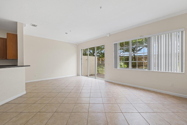 unfurnished living room featuring light tile patterned flooring and ornamental molding