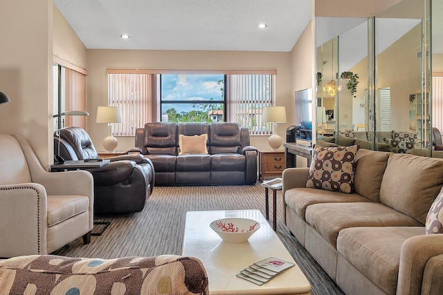 carpeted living area featuring vaulted ceiling and recessed lighting