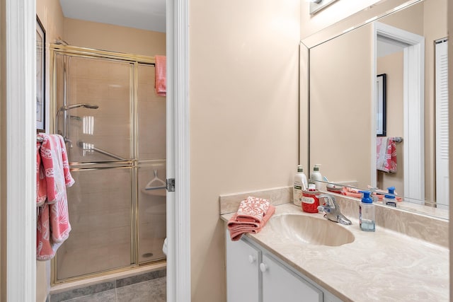 bathroom featuring an enclosed shower, vanity, and toilet