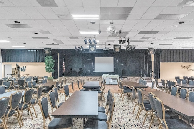 dining area featuring a drop ceiling