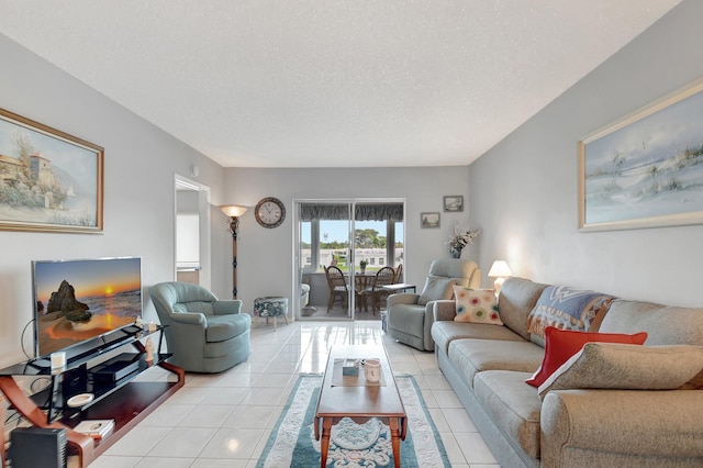 living room featuring a textured ceiling and light tile patterned flooring